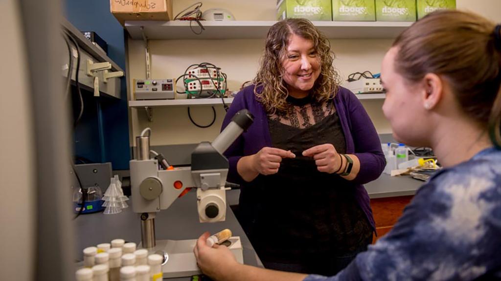 Julie Merkle with student in lab